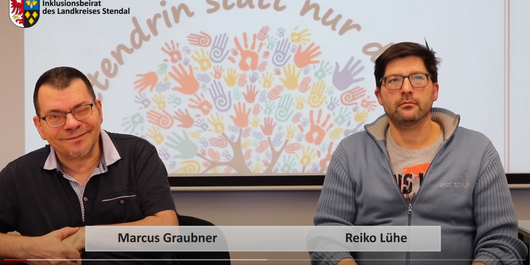 Videoausschnitt, auf dem die Vorsitzenden des Inklusionsbeirates Reiko Lühe und Marcus Graubner zu sehen sind.